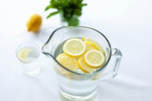 A selection of healthy morning drinks including lemon water